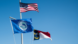The American flag, Surf City, NC flag and North Carolina state flag